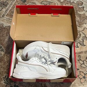 Puma gold and white athletic sneakers